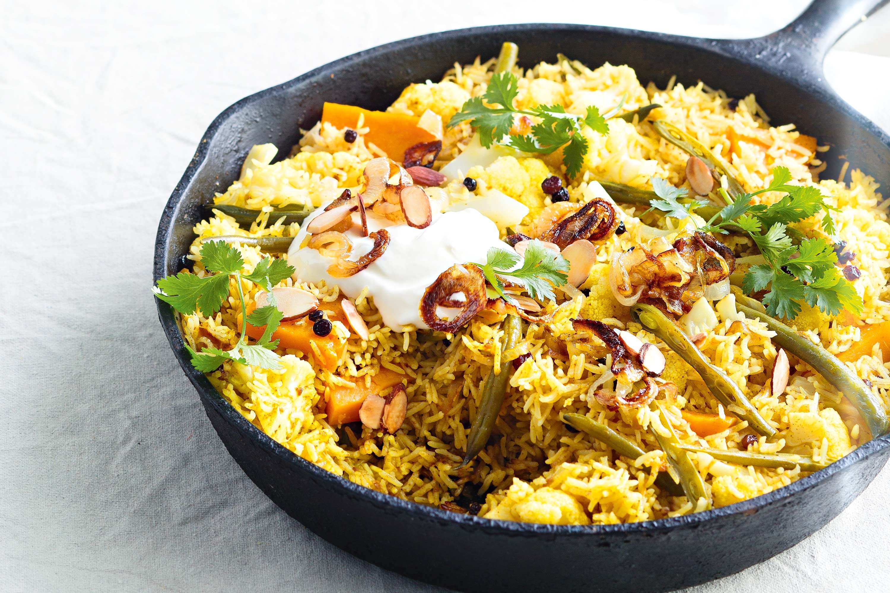 A steaming plate of the best veg biryani in Ottawa, served with aromatic spices and fresh ingredients.
